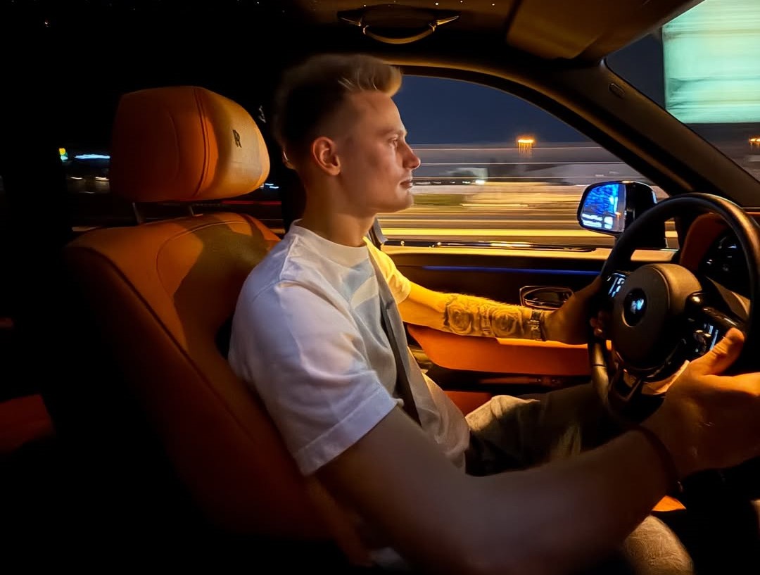 Oleksandr Orlovskyi driving a car